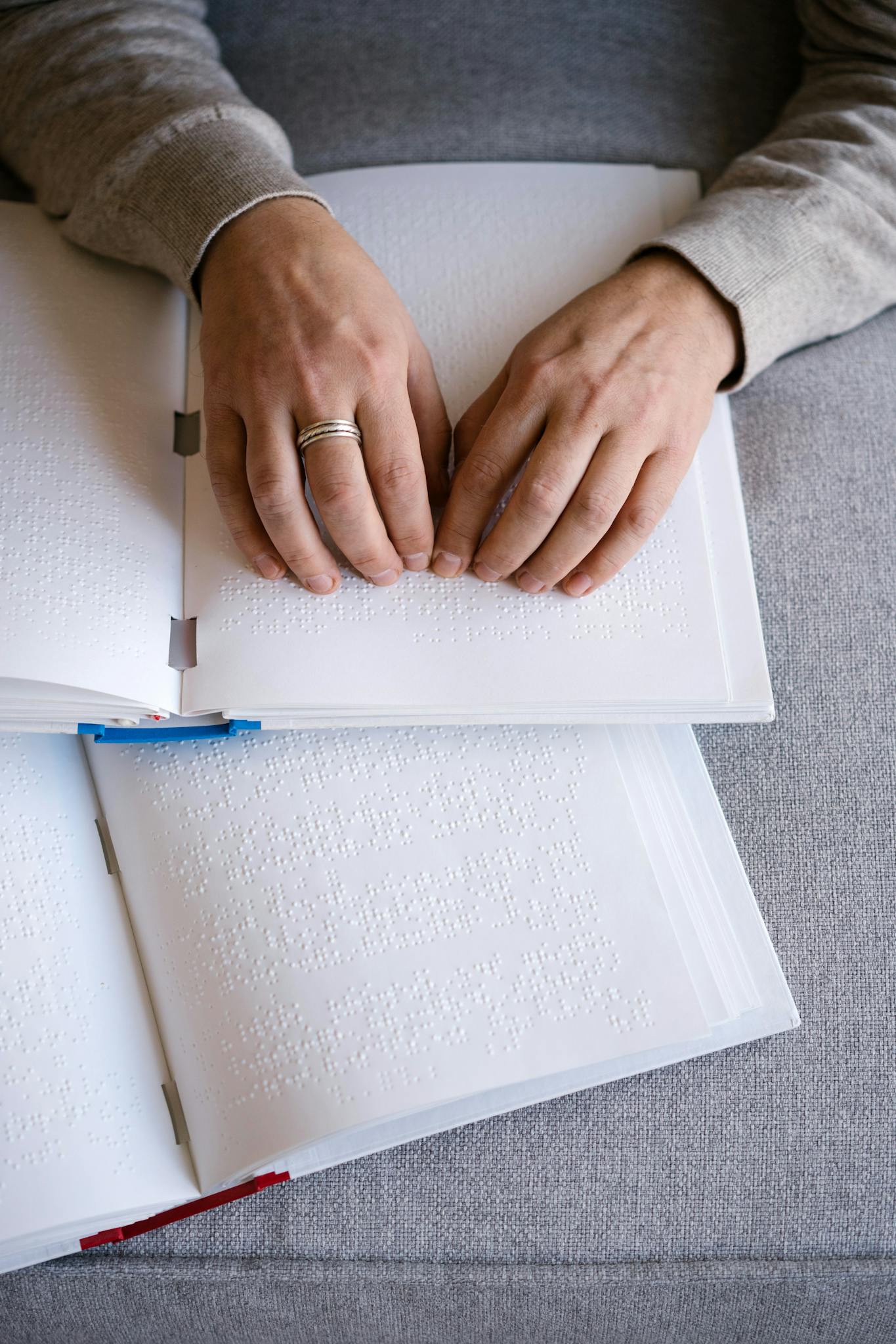 Person holding white printer paper